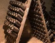 Wine bottles resting in a traditional cellar