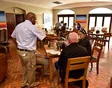 Guests comparing wines at a colourful outdoor tasting in Stellenbosch